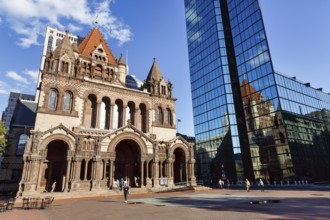 Trinity Church and John Hancock Tower, various architectural styles at Copley Square, passers-by,
