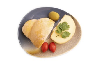 Smoked Mozzarella cheese, with tomatoes and olives isolated on white background, top view, flat