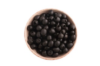 Fresh black olives in ceramic bowl Isolated on white background. Top view, flat lay, close up