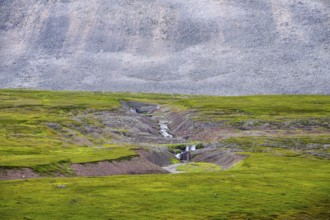 On the slope of a massive granite rock with rugged boulders at Austertanaveien 890 in the