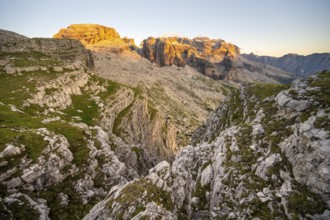 View of rocky mountain peaks of the Brenta Mountains at sunset, Alpenglühen, mountain landscape on