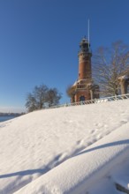 Holtenau lighthouse at the entrance of the Kiel Canal in winter, west bank of the Kiel Fjord,