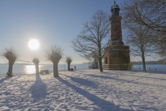 Holtenau lighthouse at the entrance of the Kiel Canal in winter, west bank of the Kiel Fjord,