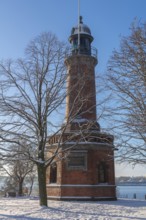 Holtenau lighthouse at the entrance of the Kiel Canal in winter, west bank of the Kiel Fjord,