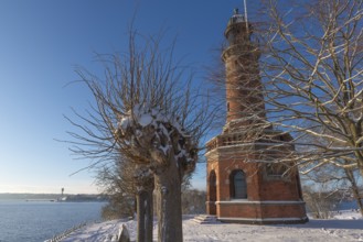 Holtenau lighthouse at the entrance of the Kiel Canal in winter, west bank of the Kiel Fjord,