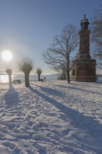 Holtenau lighthouse at the entrance of the Kiel Canal in winter, west bank of the Kiel Fjord,