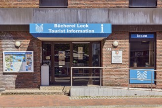 Tourist information, library leak, public library, commercial building, brick building, entrance