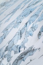 Blue rugged glacier ice with crevasses and snow, detail, Exit Glacier, Kenai Peninsula, Alaska, USA