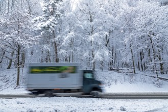 Delivery truck drives through snowy landscape, trees, winter, snow, Sieversen, Samtgemeinde
