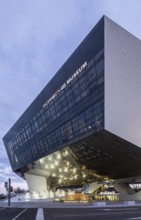 Highlights on Porscheplatz in Zuffenhausen. In front of the Porsche Museum and the car