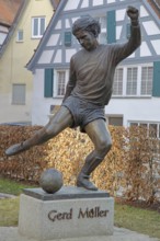 Memorial to soccer player Gerd Müller, German national team player, soccer legend, bronze