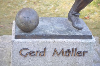 Memorial to soccer player Gerd Müller, German national team player, soccer legend, bronze