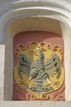 City coat of arms with eagle figure and crown, Reimlinger Tor, Nördlingen, Bavaria, Germany