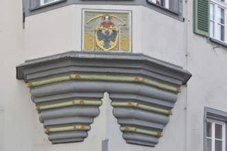 City coat of arms at the former Holy Spirit Hospital building built in 1564, house corner,