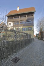 Historic half-timbered house with wooden fence, Mittlere Gerbergasse, Nördlingen, Bavaria, Germany