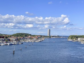 View over the Trave towards the mouth in the underground, the church of Travemünde and the Atlantic