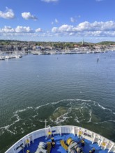 View from a ship's hull across the water towards the harbor entrance, Travemünde, Lübeck,