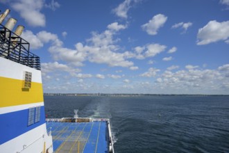 TT-Line ferry on calm sea with blue sky and scattered clouds in the background, Trelleborg, Skåne