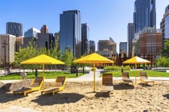 Yellow sun umbrellas and beach chairs create a vibrant pop of color against the backdrop of
