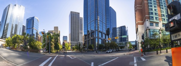 Panoramic view capturing calgary's downtown core, featuring modern office towers, vibrant traffic