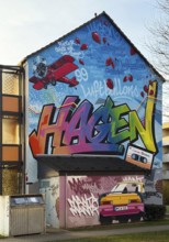 Street art with the music theme Neue Deutsche Welle on a house façade, apartment building in the