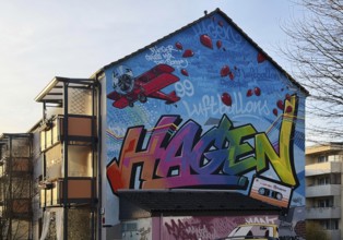 Street art with the music theme Neue Deutsche Welle on a house façade, apartment building in the