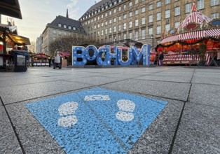 Selfie point with Bochum lettering on the town hall forecourt with Christmas market at Bochum City