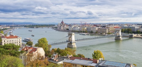 Hungarian parliament along the Danube River and Chain Bridge, Budapest, Hungary