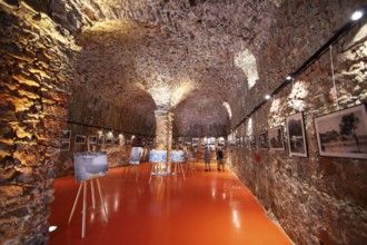 Exhibition at the Porto tourist office, a former Genoese weapons warehouse, interior view, Ota,