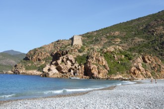 Genoese tower on the pebble beach of Porto, Ota, west coast of Corsica, Corse-du-Sud, Corsica,