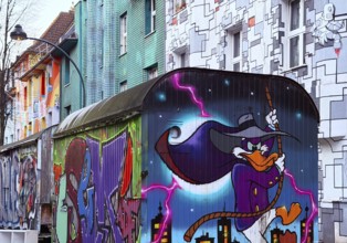 Kiefernstraße with street art and artistically designed construction trailer and street art from