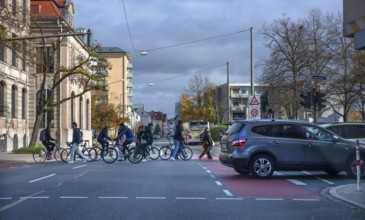 Pedestrians crossing a road junction, Erlangen, Middle Franconia, Bavaria, Germany