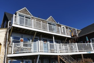 Typical architecture, wooden shingles, white railings, decks, outdoor stairs, Bearskin Neck,