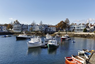 Scenic view of fishing boats and typical architecture, blue sky, Bradley Wharf, Bearskin Neck,