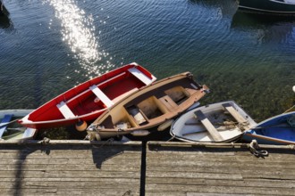 Small rowing boats moored on a wooden pier, sunny weather, view from above, Bradley Wharf, Bearskin