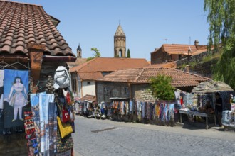 A picturesque village with souvenir stalls and old buildings that exudes a peaceful atmosphere, old