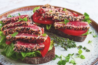 Sandwiches with fried tuna fillet in sesame seeds, breakfast, top view, homemade