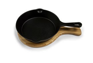 Portioned cast iron frying pan, on a wooden stand, new, on a white background, isolate