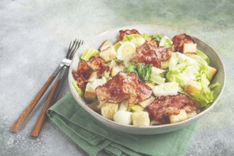 Caesar salad with fried bacon, quail eggs, homemade, no people
