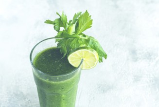 Glass with green smoothie, celery and spinach, apple and kiwi, cucumber, vegetable smoothie,