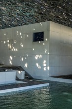 Interior design in Louvre Abu Dhabi, art museum by French architect Jean Nouvel, buildings on
