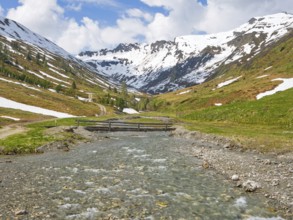 Riedingtal nature park Park, Riedingbach, snow-capped mountains, stream with bridge, hiking,