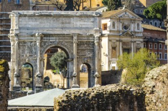 View of the triumphal arch of Severus Severus Severus right next to former prison Carcer Tullianus