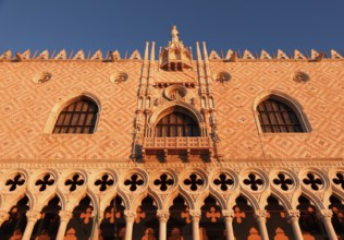Sun rays at sunrise on the façade of the Doge's Palace, Venice, Veneto, Italy