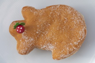 Traditional lucky pig cake served on a plate, as a sweet New Year's pastry and symbol of good luck