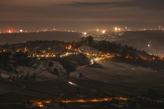 New Year's Eve view from Kapellberg near Fellbach towards Rotenberg. View of the grave chapel in