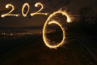 New Year's Eve atmosphere in Stuttgart at the turn of 2025 to 2026: In the foreground, a painted
