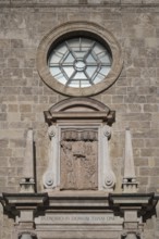 Relief above the entrance to the parish church of St. Quirinus, Tegernsee Abbey, castle with