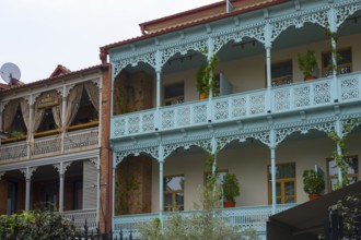 Traditional Caucasian architecture with decorated balconies and wooden railings decorated with