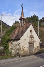 Ibiza old chapel, historic chapel, lantern, sidewalk, road, hill, coniferous forest, blue sky,